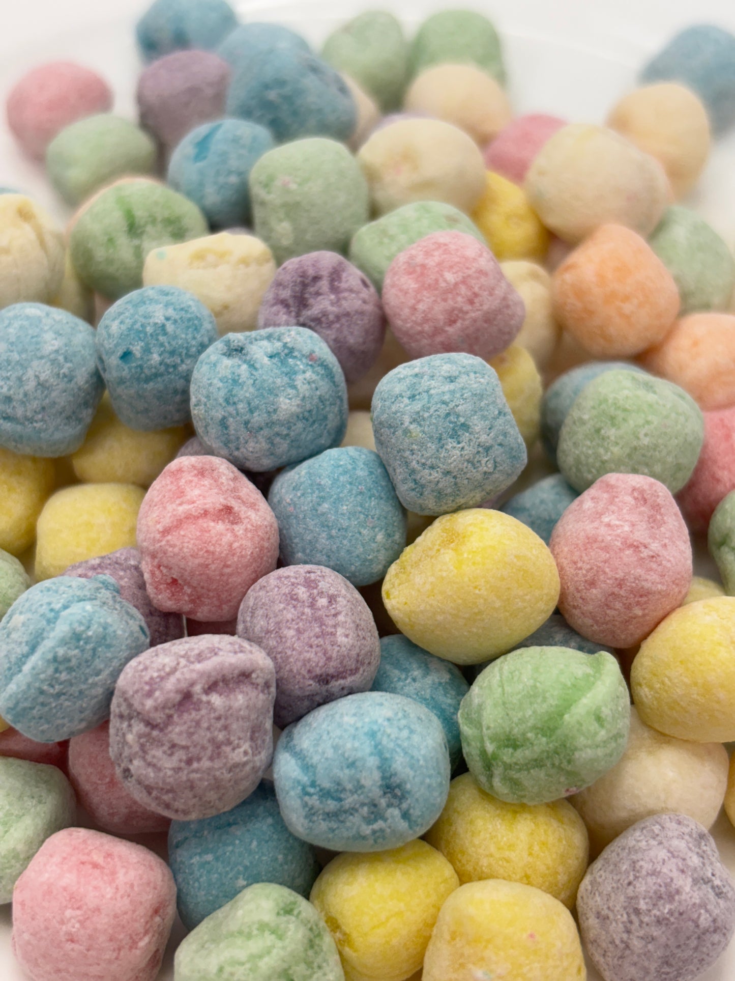 colorful fizzy rock candy with pastel shades of blue, pink, yellow, green, and purple