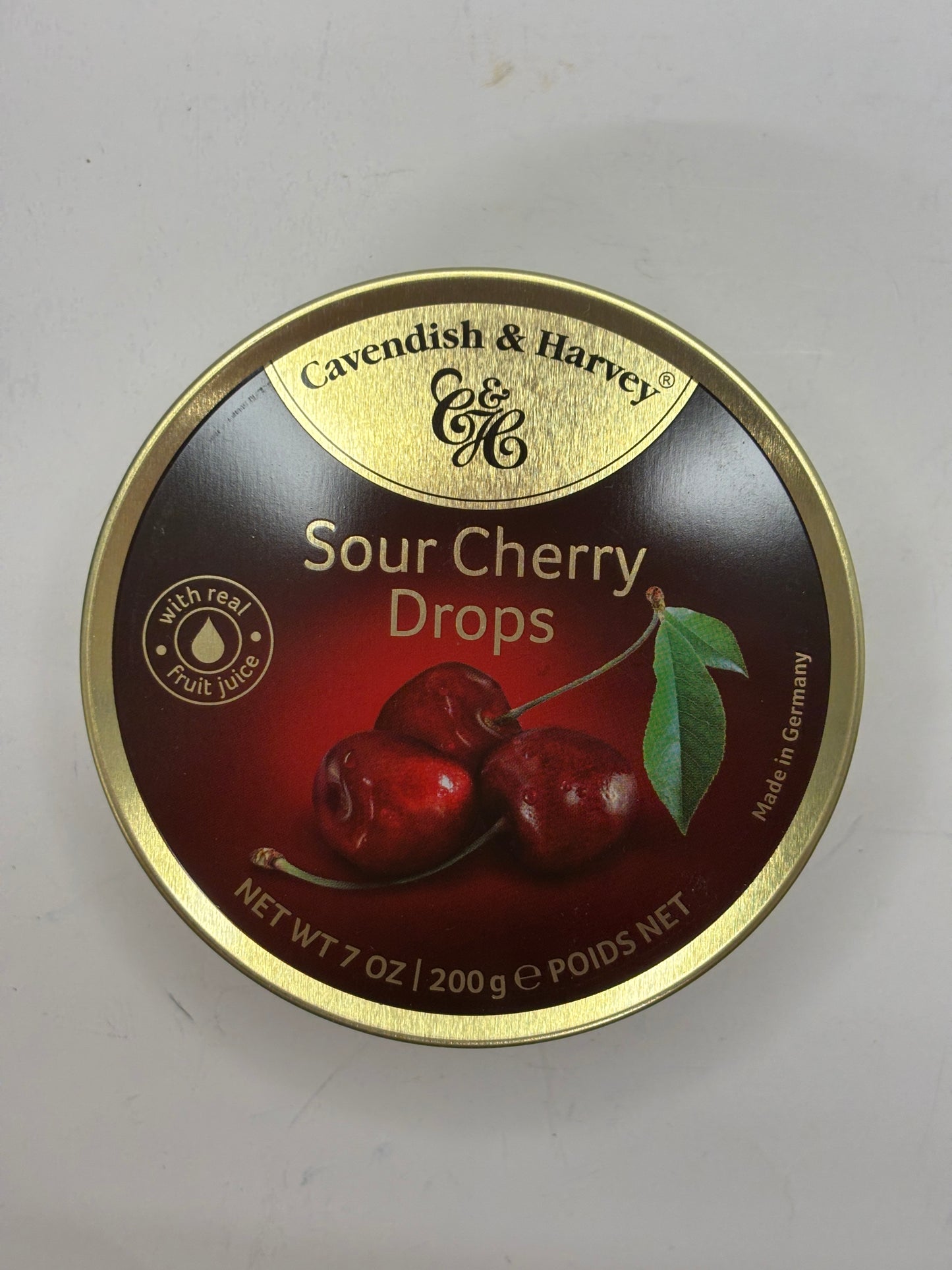 Cavendish and Harvey sour cherry candy drops tin with image of cherries and gold trim
