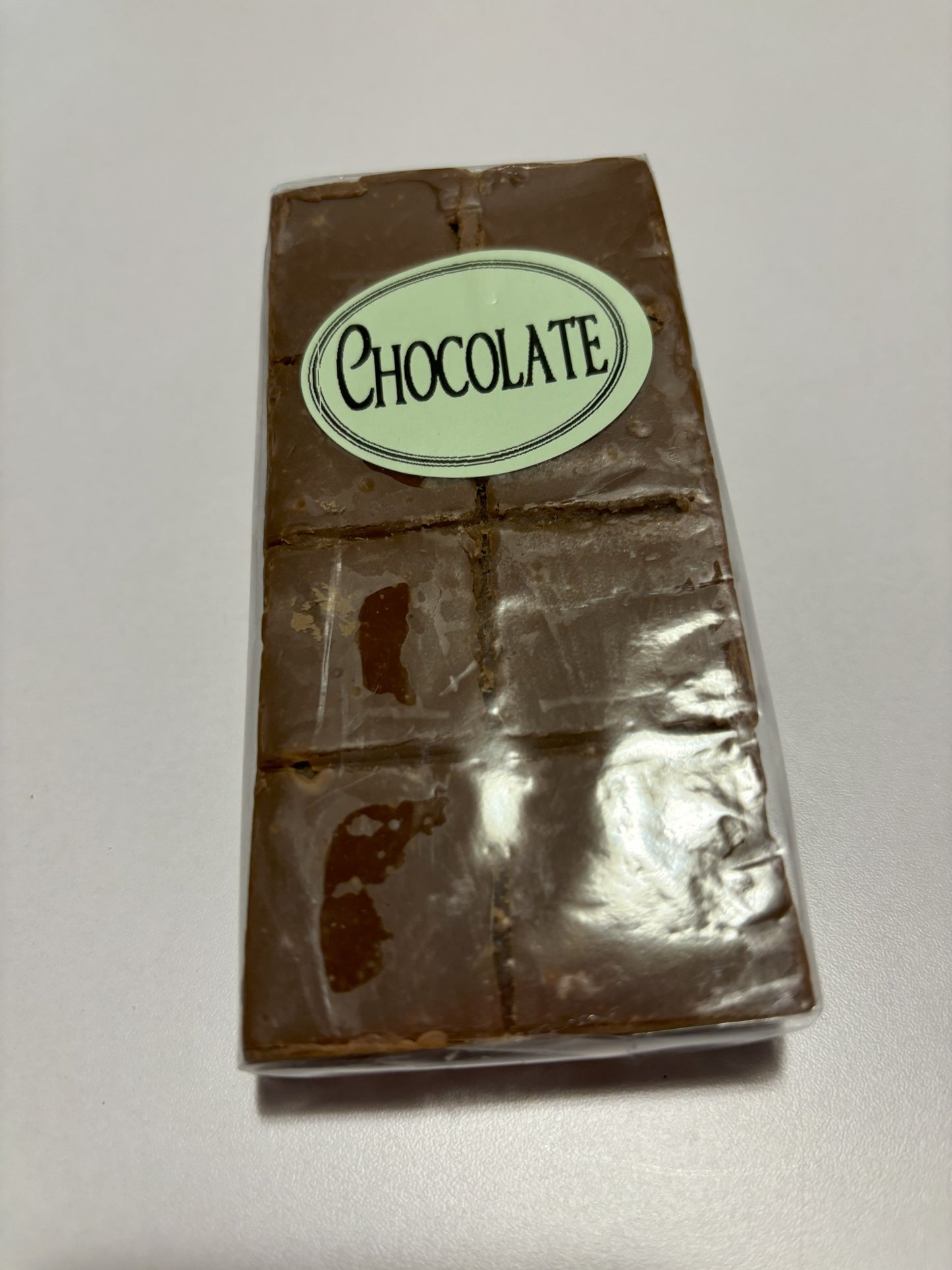 Select Sweets chocolate fudge bar with smooth, glossy surface and segmented squares