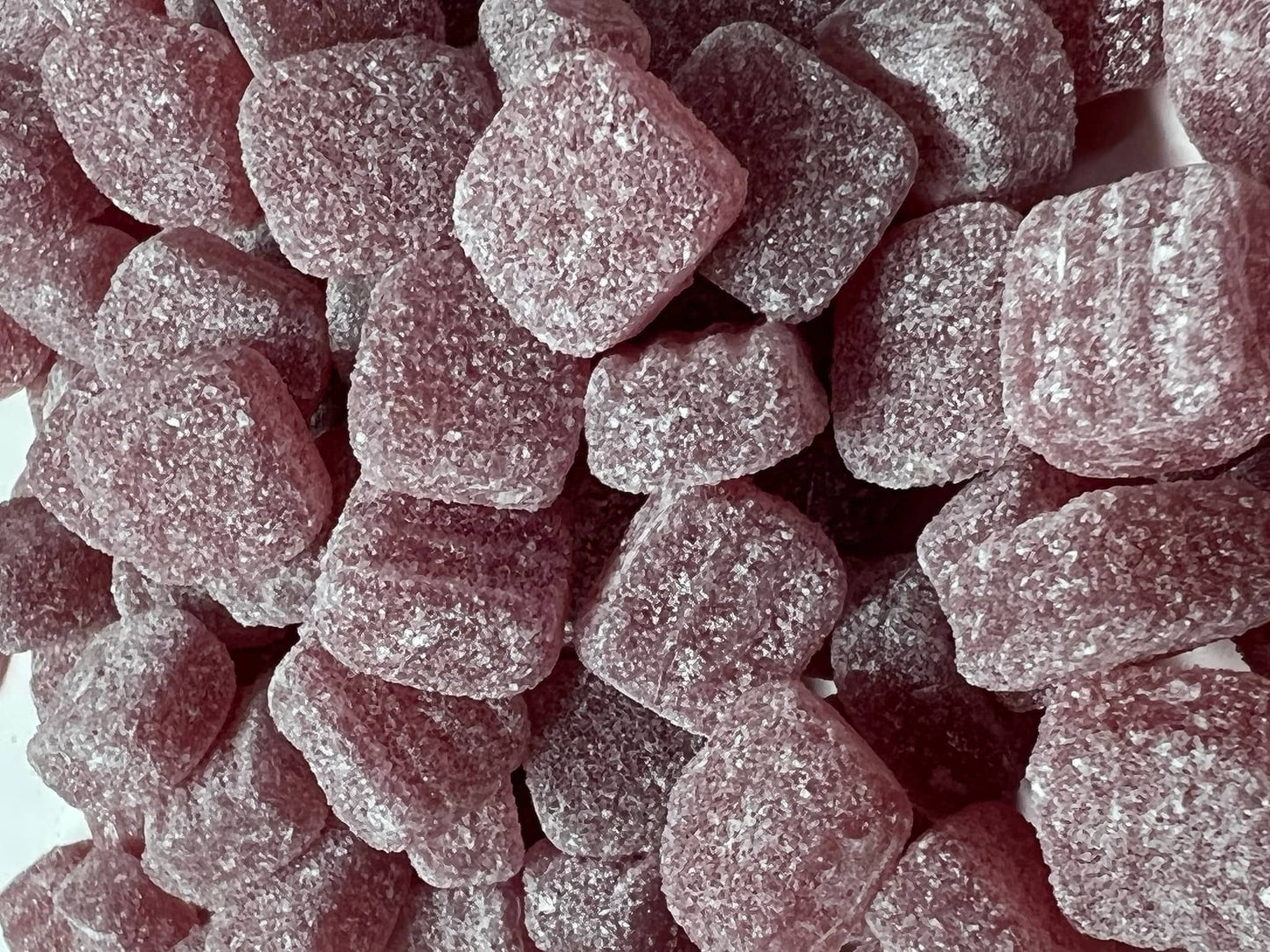 Close-up of Euco menthol jubes, chewy mint-flavored candies coated in sugar, perfect for freshening breath