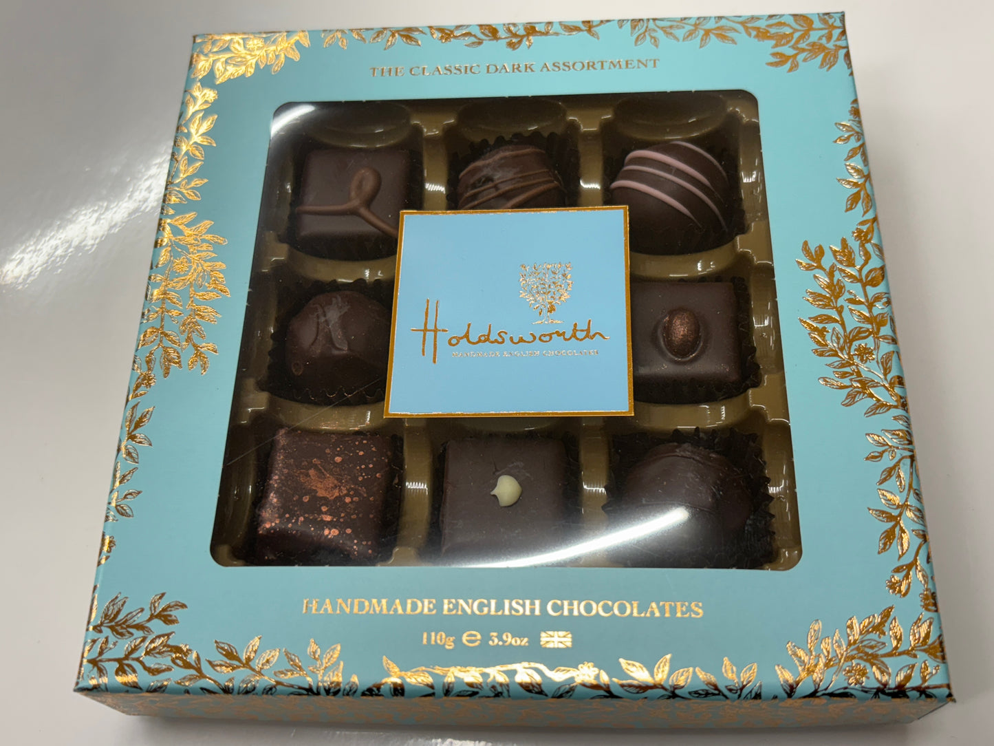 Holdsworth dark chocolate assortment in an elegant box featuring assorted handmade English chocolates