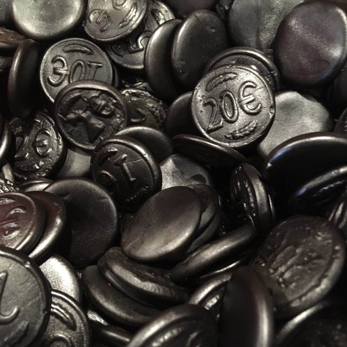 SelectSweets black licorice coin-shaped candies with embossed euro symbols and numbers