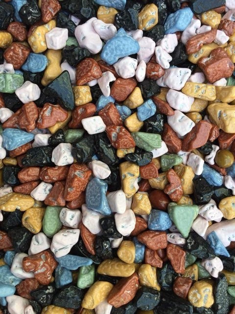 Colorful edible chocolate stones in various shapes and colors resembling small rocks