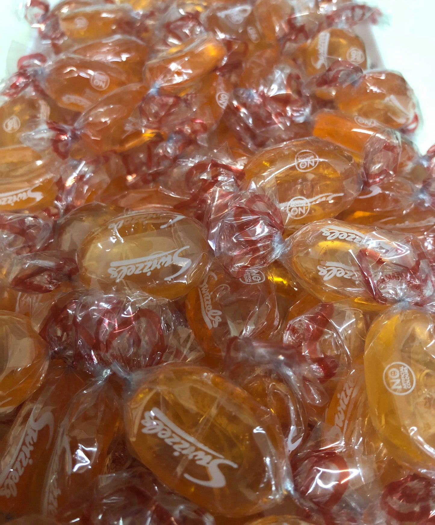 SelectSweets1 English barley sugar candy individually wrapped in clear reddish twist wrappers
