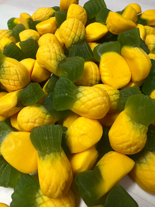 Close-up of SelectSweets1 Allens Pineapples candy with yellow and green pineapple-shaped gummies