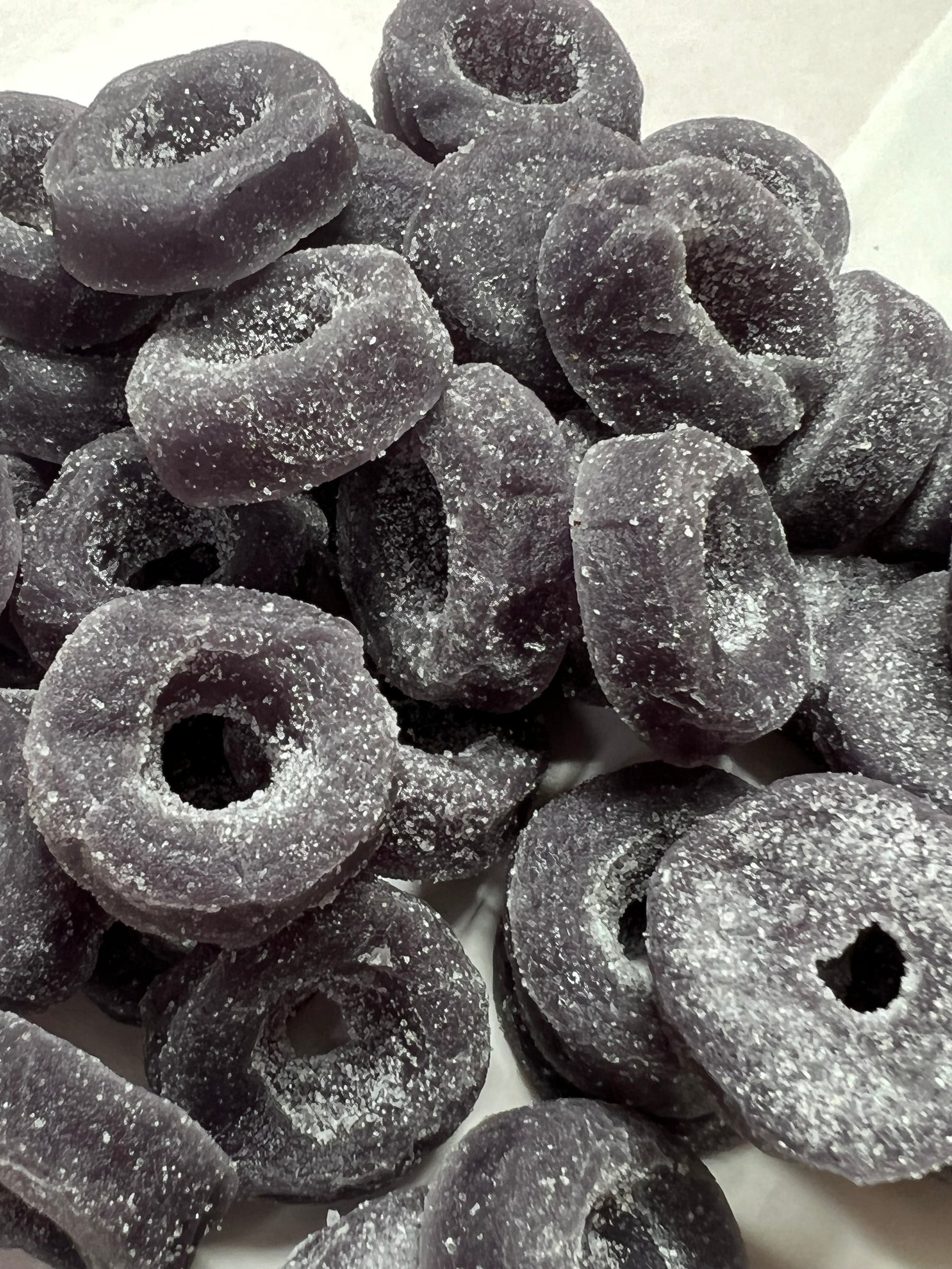 SelectSweets aniseed rings candy coated with sugar in a close-up view