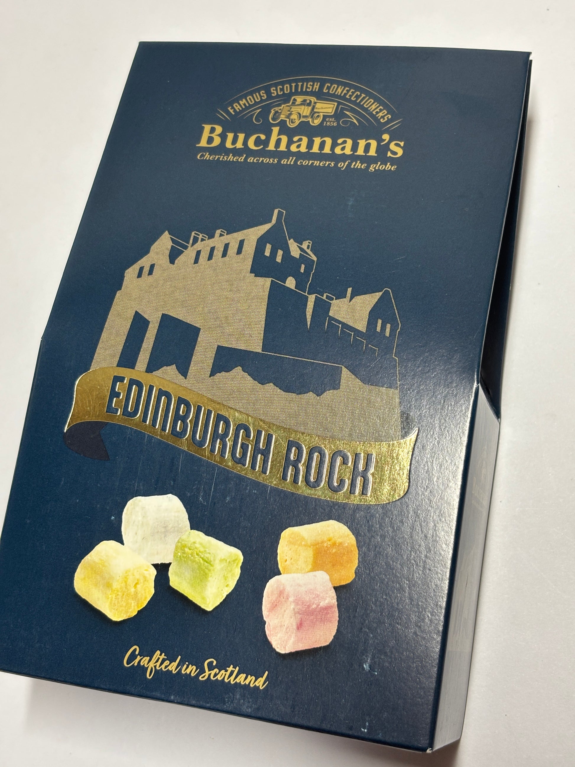 Buchanan's Edinburgh Rock candy box featuring colorful sweet pieces crafted in Scotland
