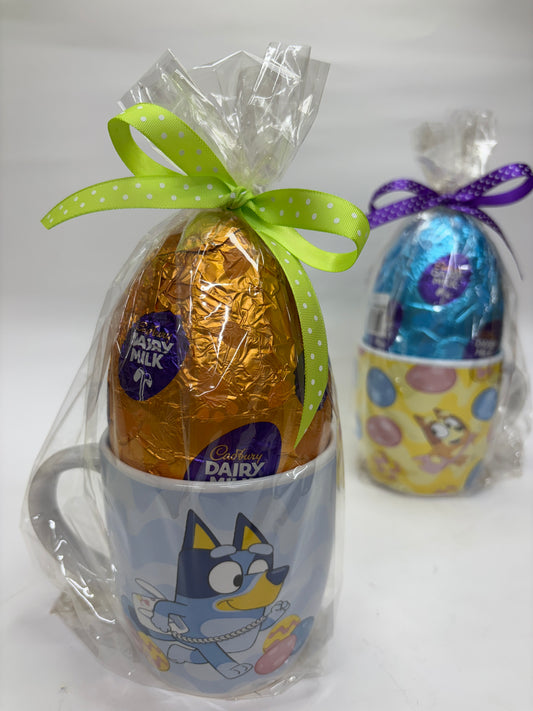 Cadbury Dairy Milk Easter Egg in a Bluey egg cup, wrapped in cellophane for festive gifting