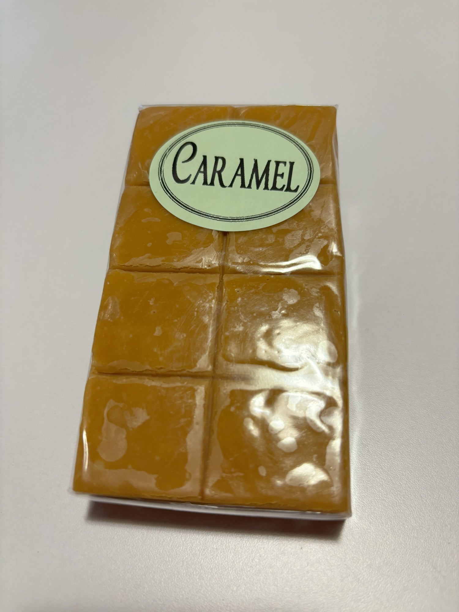 Select Sweets caramel fudge candy bar with six square pieces wrapped in clear plastic