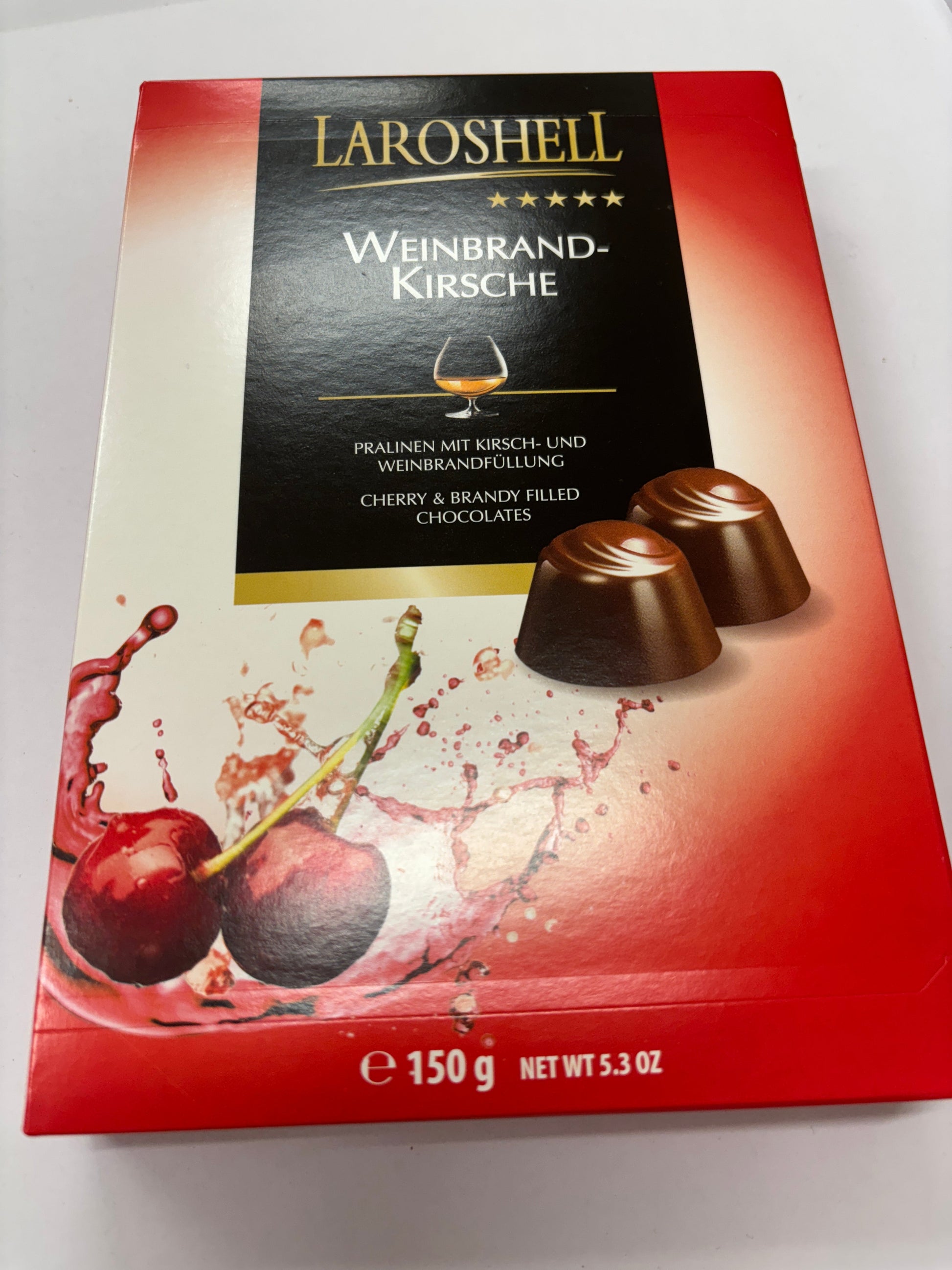 Laroshel cherry brandy chocolates in a red box with cherry illustrations and rich chocolate texture