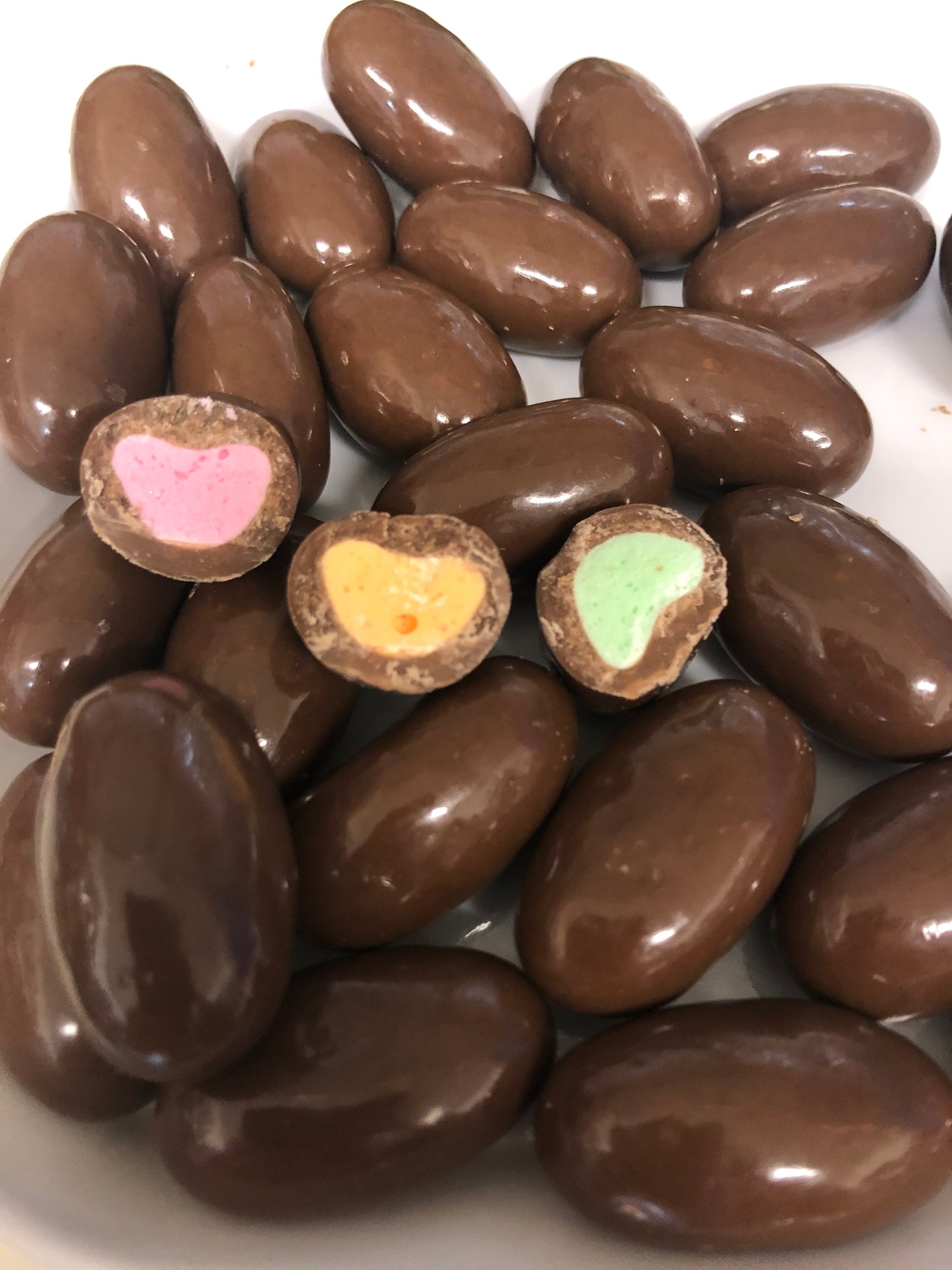 SelectSweets chocolate clinkers candy with colorful fruit-flavored centers coated in smooth milk chocolate