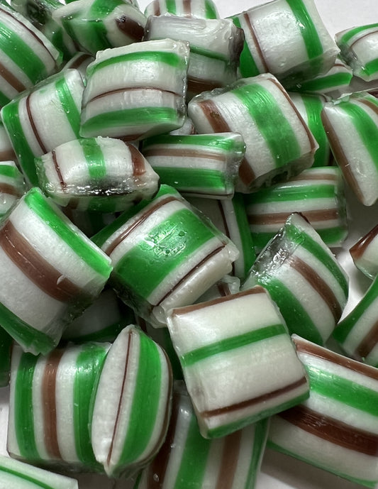 Close-up of SelectSweets chocolate mint candy with green, white, and brown stripes