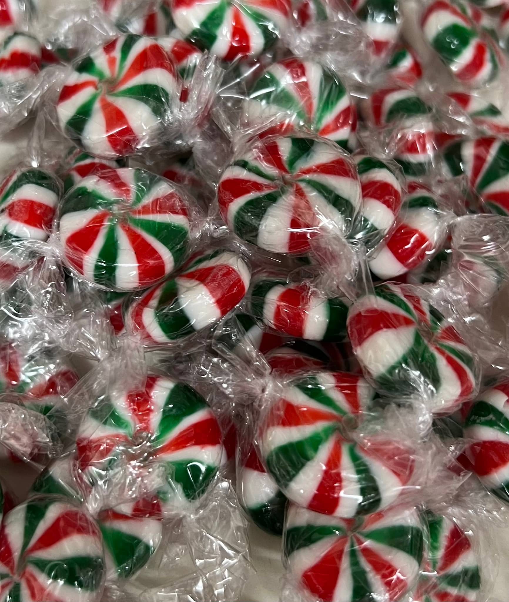 Select Sweets Christmas starlight mints wrapped in clear plastic with red and green swirls