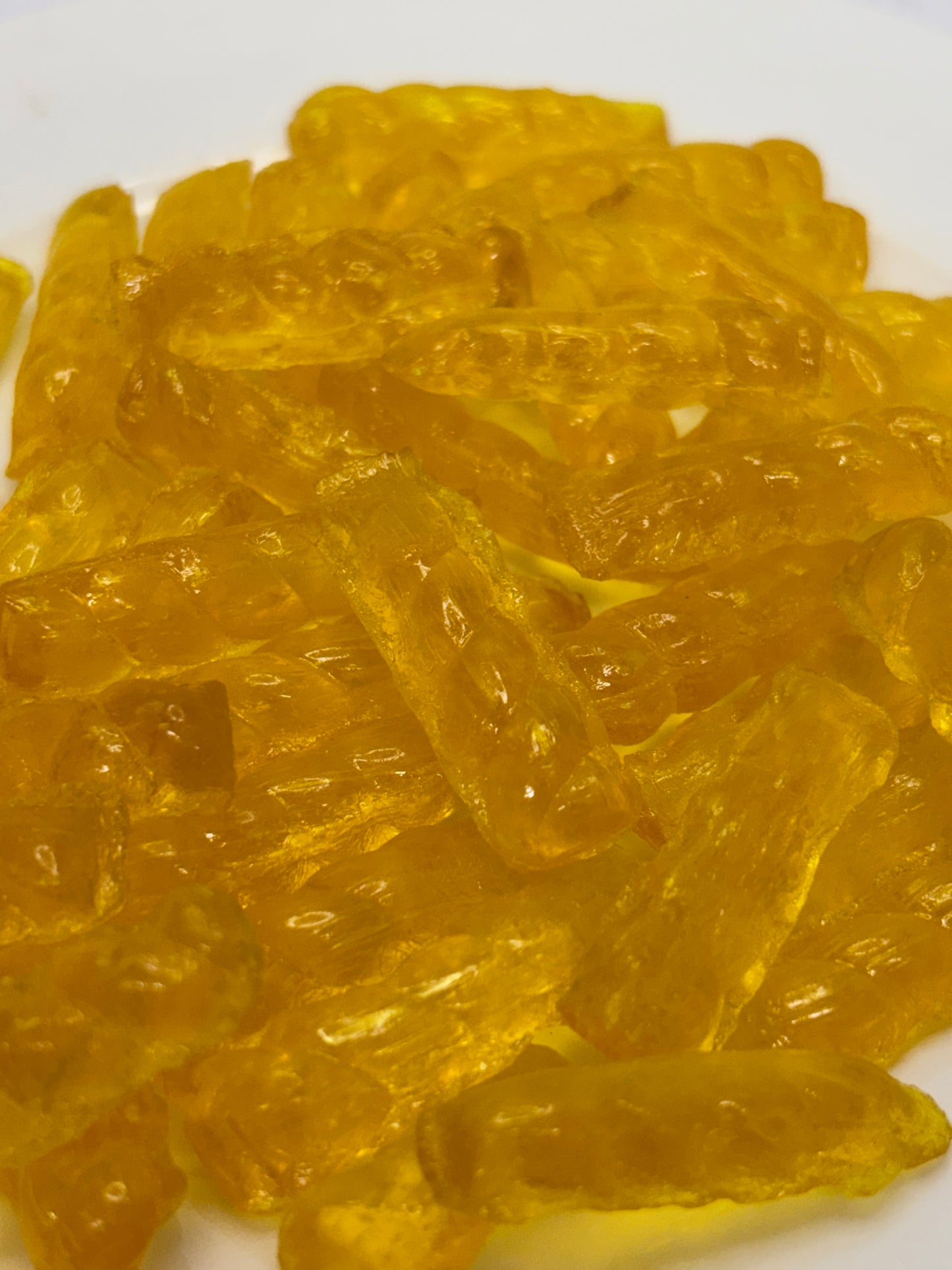 Close-up of Select Sweets golden barley sugar twist candy with translucent texture