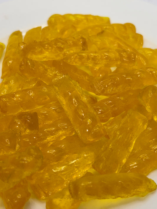 Close-up of Select Sweets golden barley sugar twist candy with translucent texture