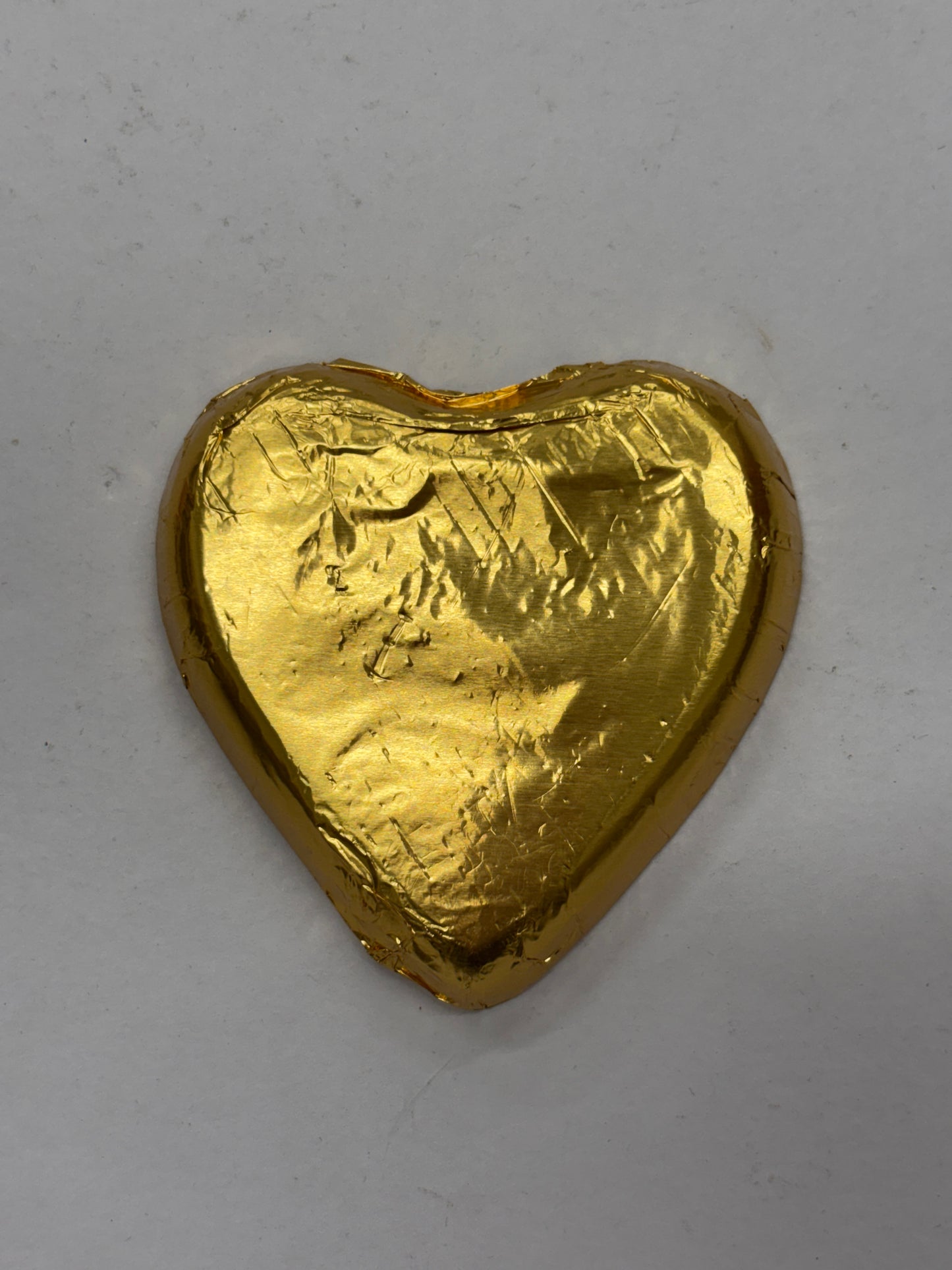 Select Sweets dark chocolate heart wrapped in gold foil for a delightful gift or treat