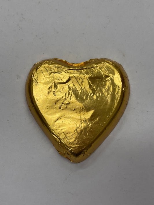 Select Sweets dark chocolate heart wrapped in gold foil for a delightful gift or treat