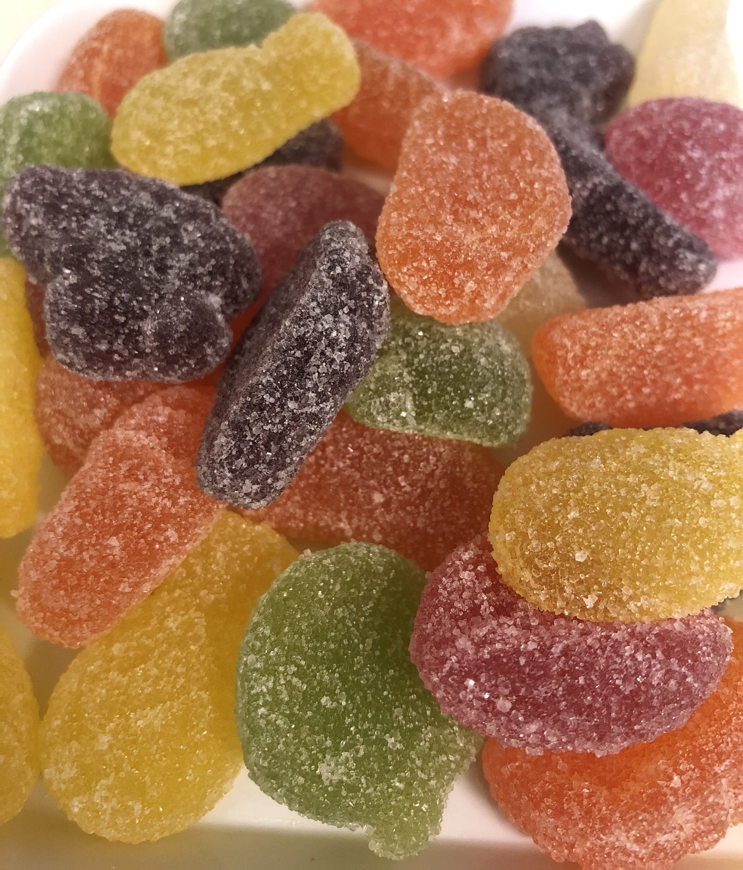 Close-up of colorful English fruit jellies candy coated with sugar crystals