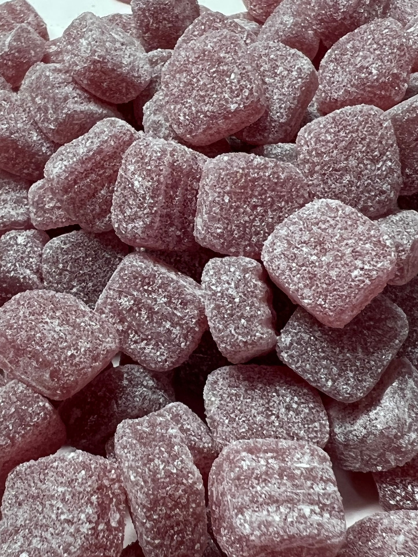 Close-up of Euco menthol jubes, chewy mint-flavored candies coated in sugar, perfect for freshening breath