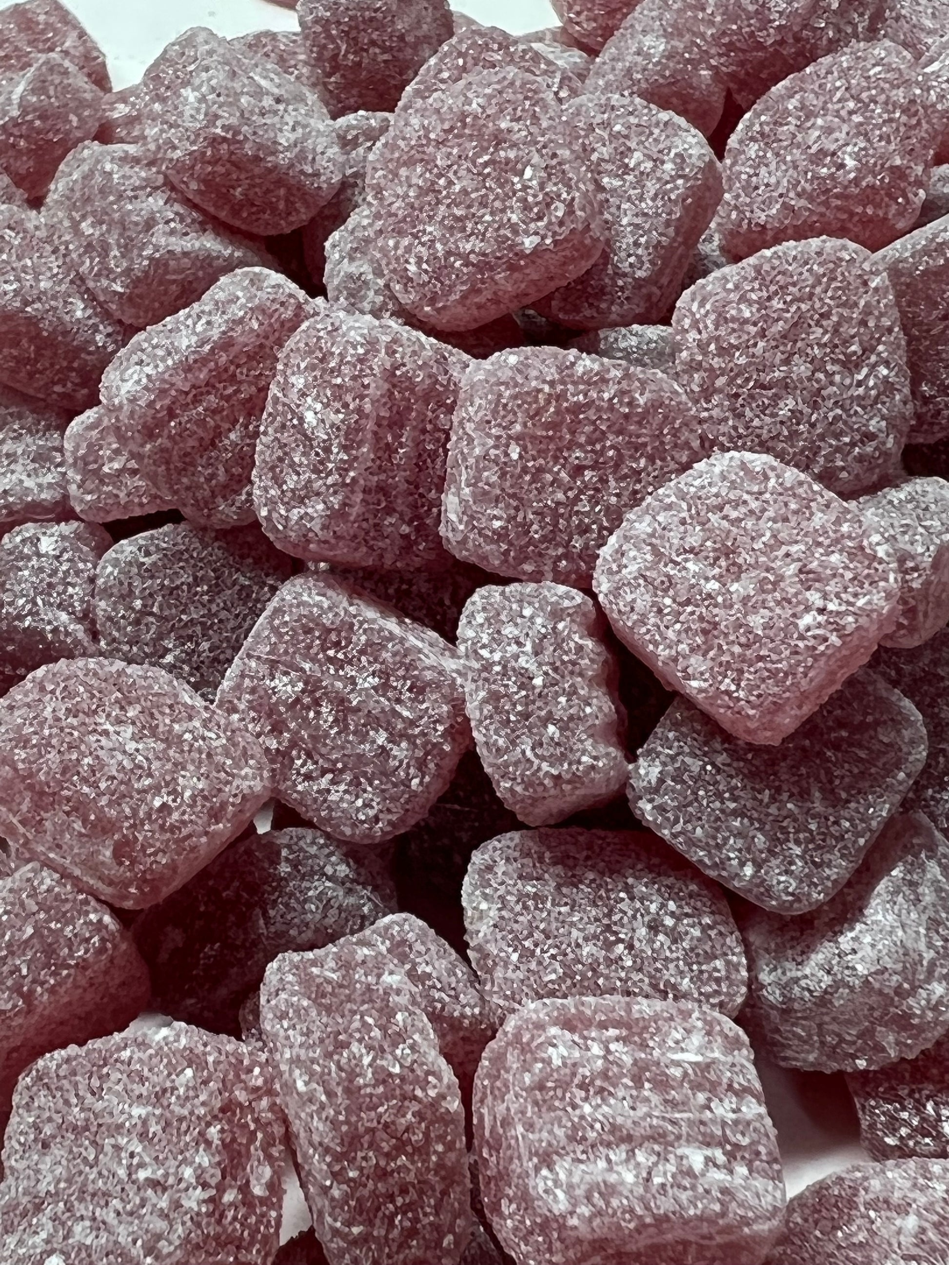 Close-up of Euco menthol jubes, chewy mint-flavored candies coated in sugar, perfect for freshening breath