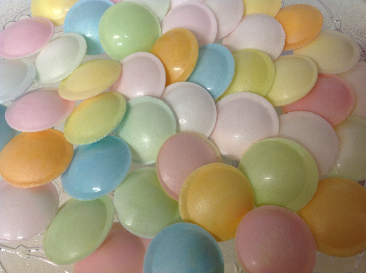 Colorful flying saucer candy assortment with sugary crisp shells filled with sweet powder