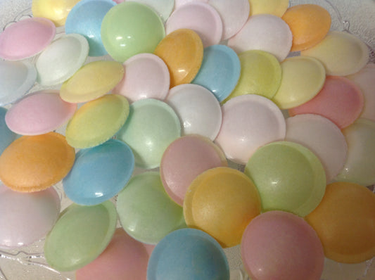 Colorful flying saucer candy assortment with sugary crisp shells filled with sweet powder