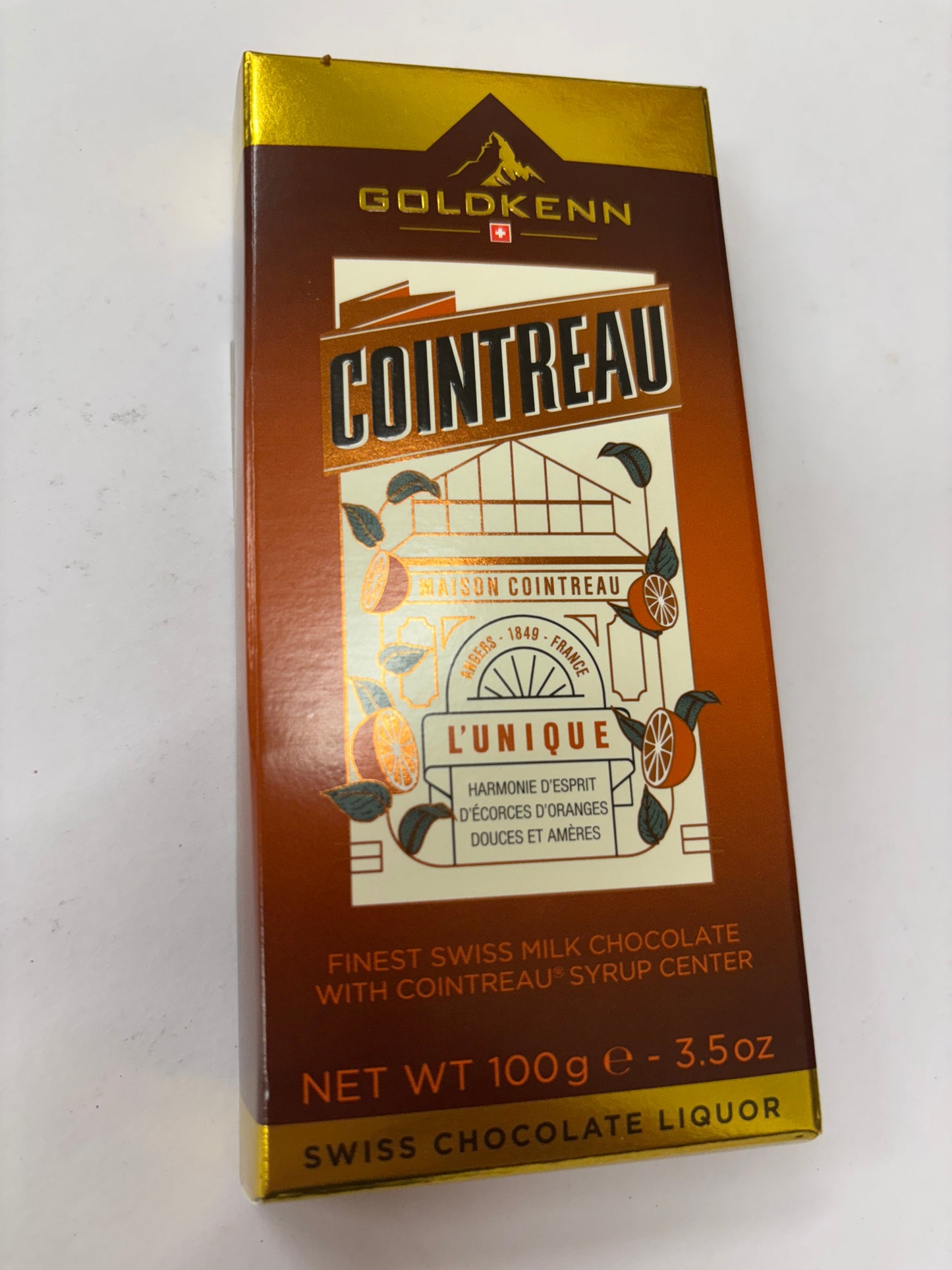 Cointreau chocolate bar with Swiss milk chocolate and Cointreau syrup center in a vibrant package