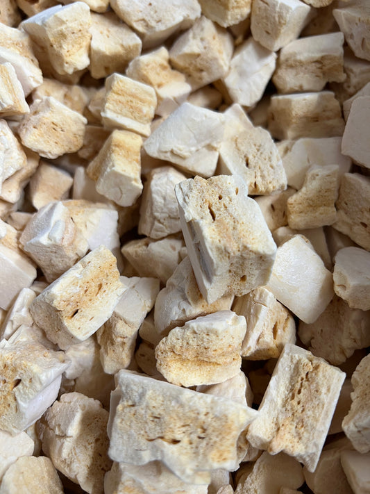 Close-up of Select Sweets honeycomb candy pieces with light golden and white textures