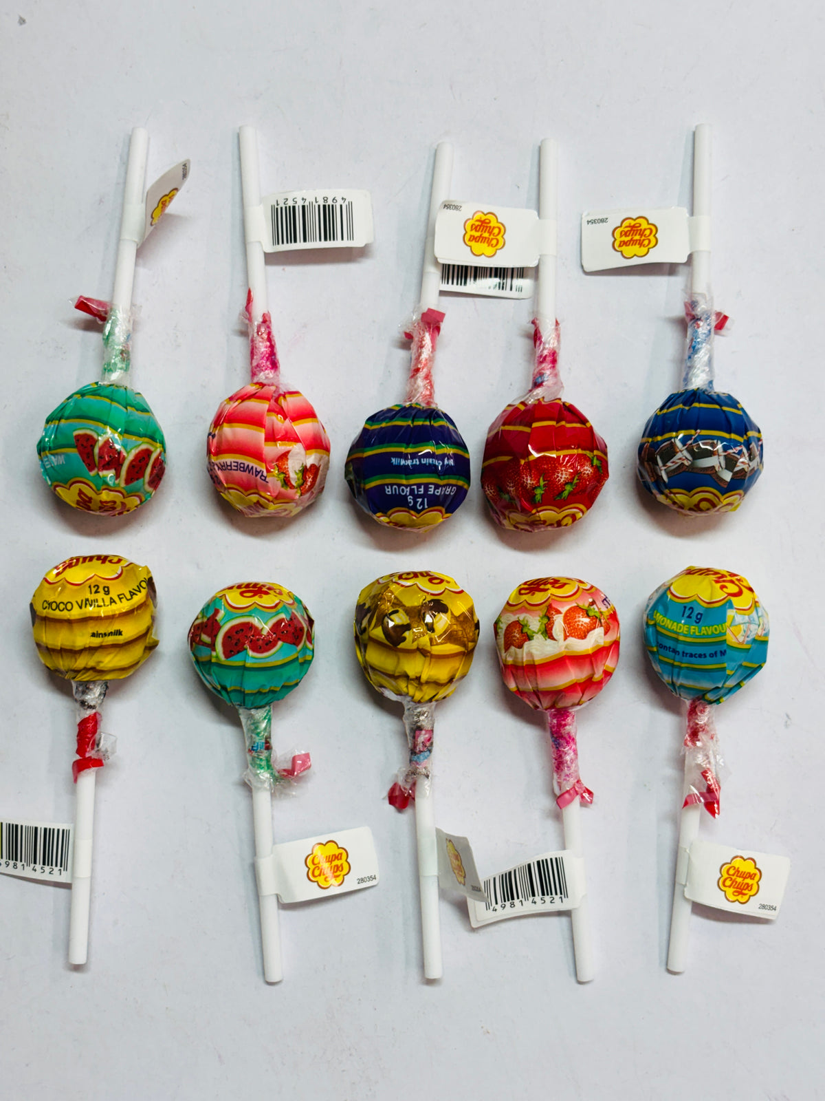 Colorful Select Sweets lollipops displayed on a white background in various flavors and designs