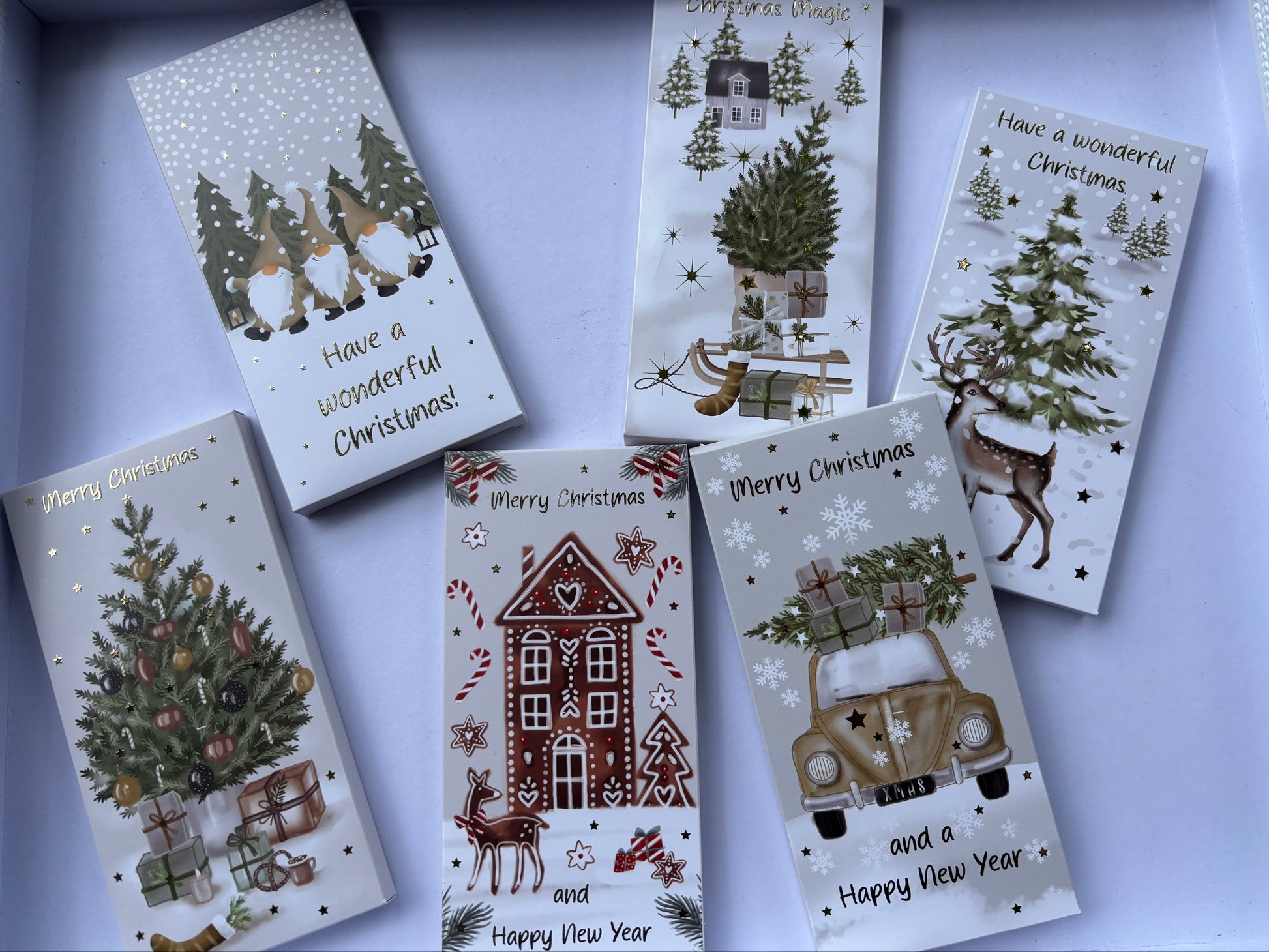 Milk chocolate Christmas block in festive packaging featuring Christmas trees and winter scenes