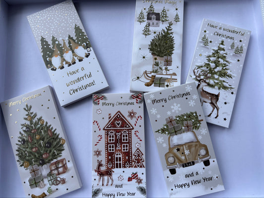Milk chocolate Christmas block in festive packaging featuring Christmas trees and winter scenes