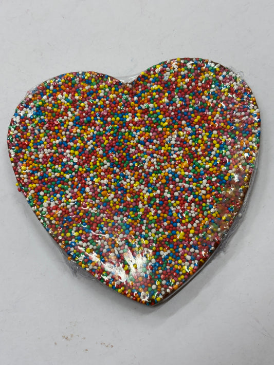 Select Sweets milk chocolate freckle heart covered in colorful sprinkles for a sweet treat