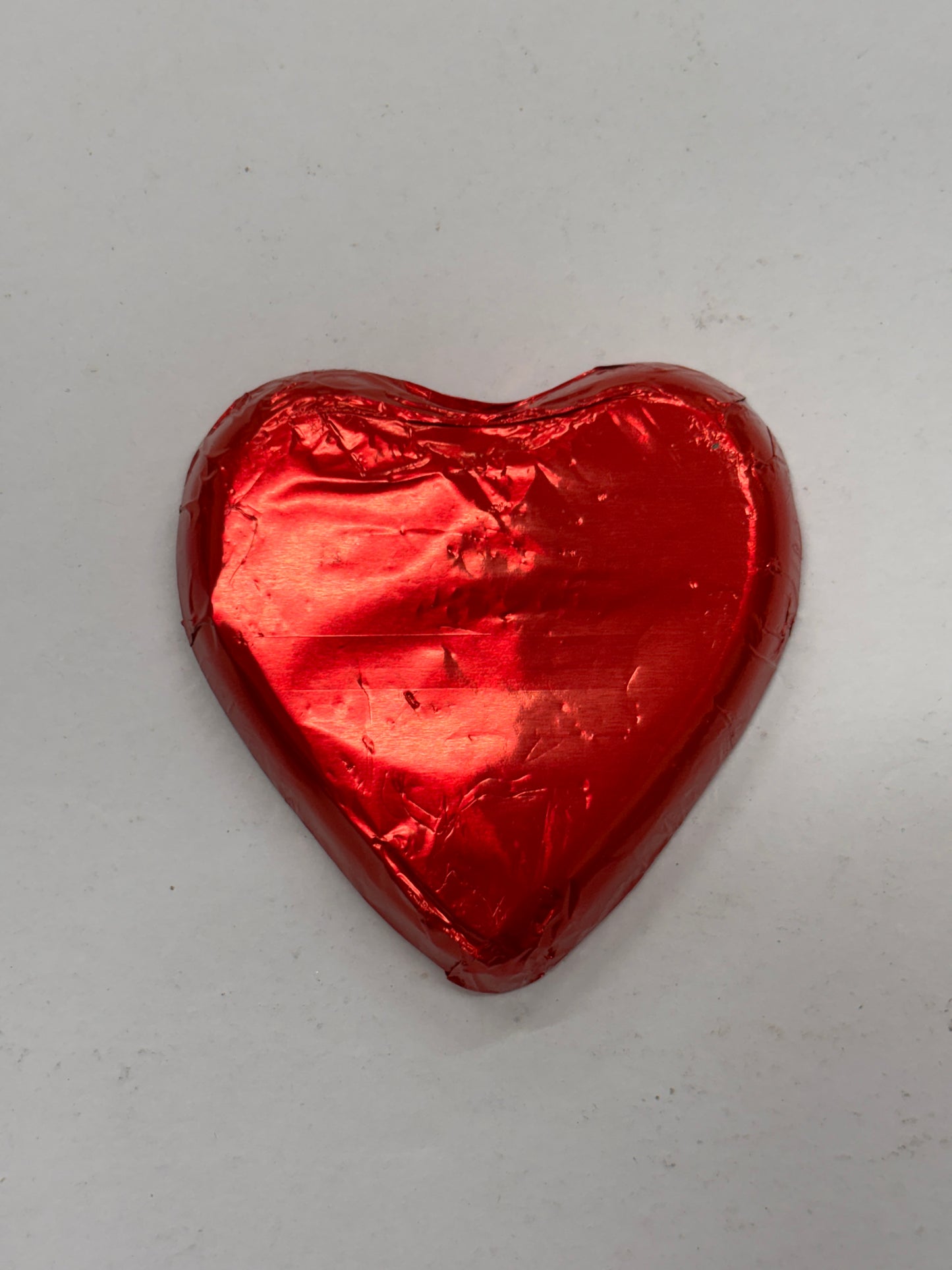 Select Sweets milk chocolate heart wrapped in shiny red foil for festive gifting