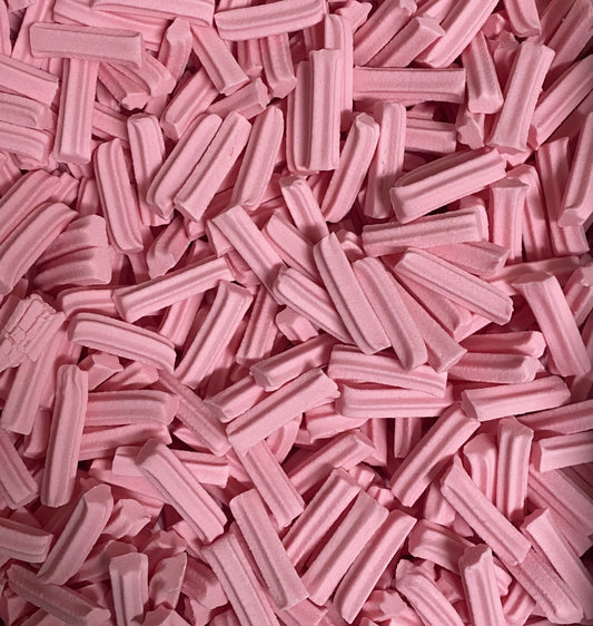 Close-up of pink Select Sweets mini musk sticks candy showing texture and color