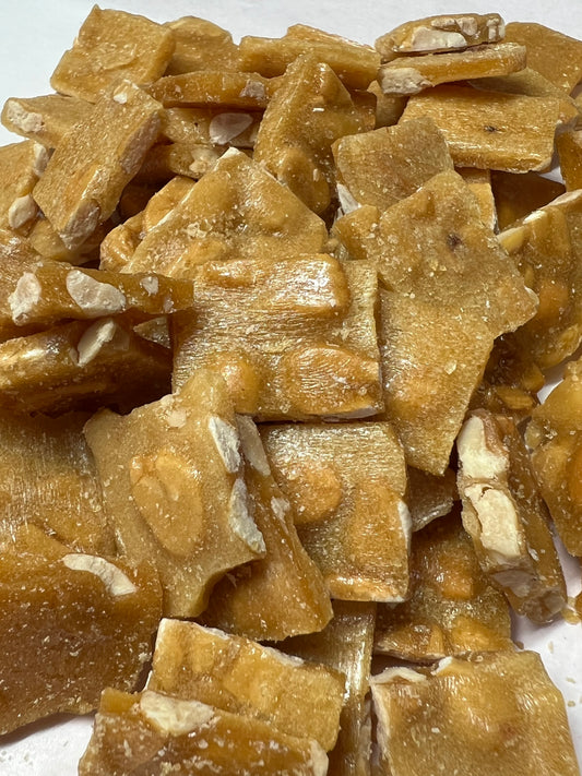 SelectSweets old fashioned peanut brittle pieces with visible nuts and golden caramel texture