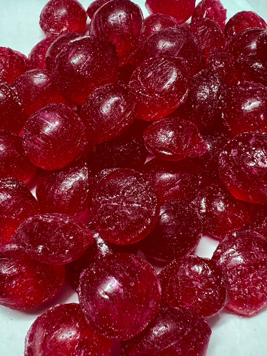 SelectSweets raspberry hard candy in dark red color with glossy texture close-up view