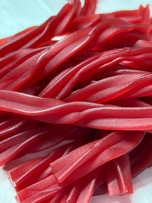 Close-up of bright red SelectSweets raspberry twists candy with a textured surface