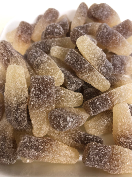 Close-up of SelectSweets sour cola bottle candy coated with sugar crystals
