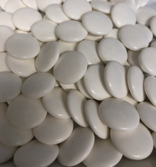 Close-up of SelectSweets1 strong peppermint candies in smooth white round shapes