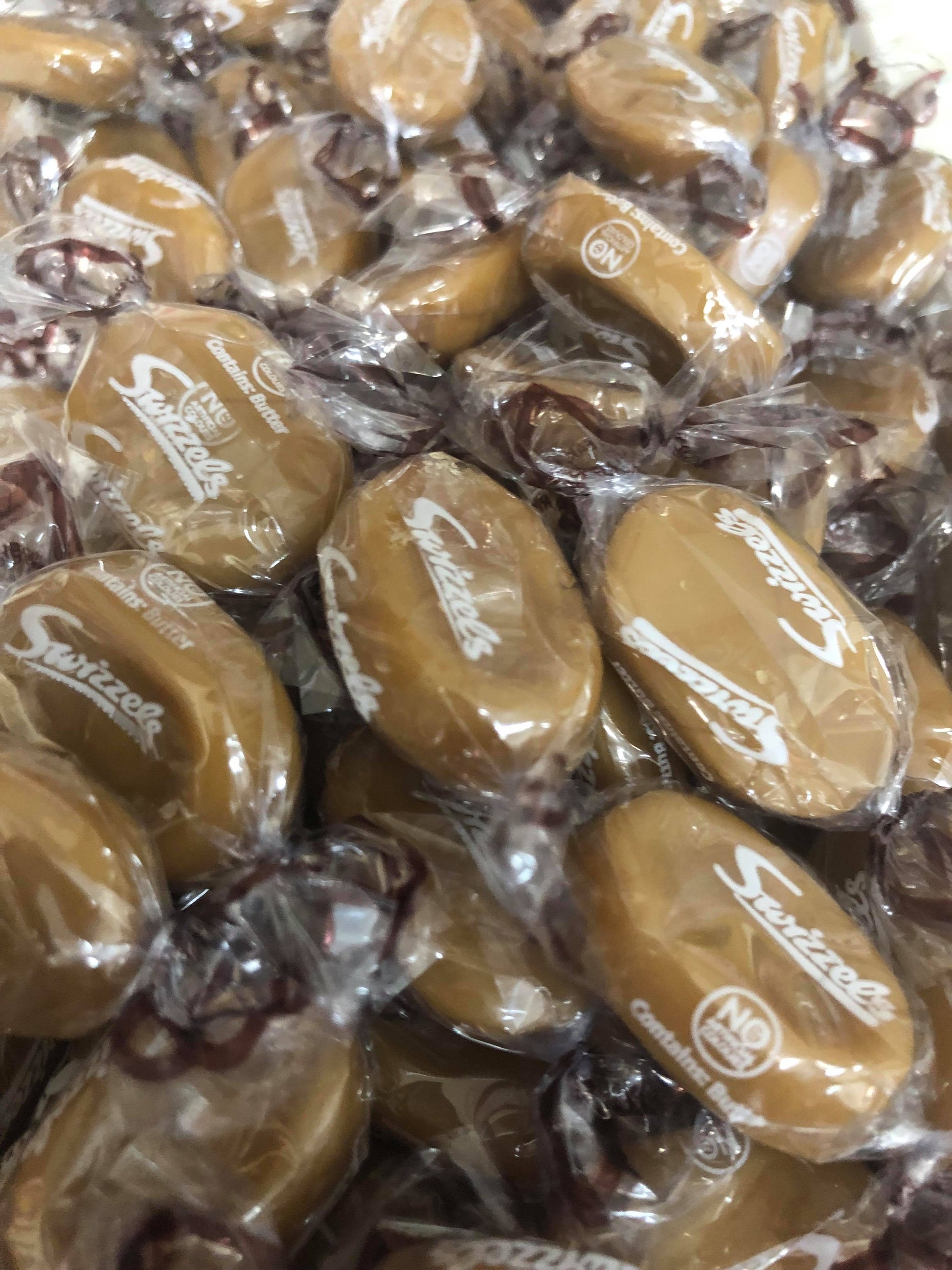 Close-up of SelectSweets1 English butterscotch candy individually wrapped in clear plastic