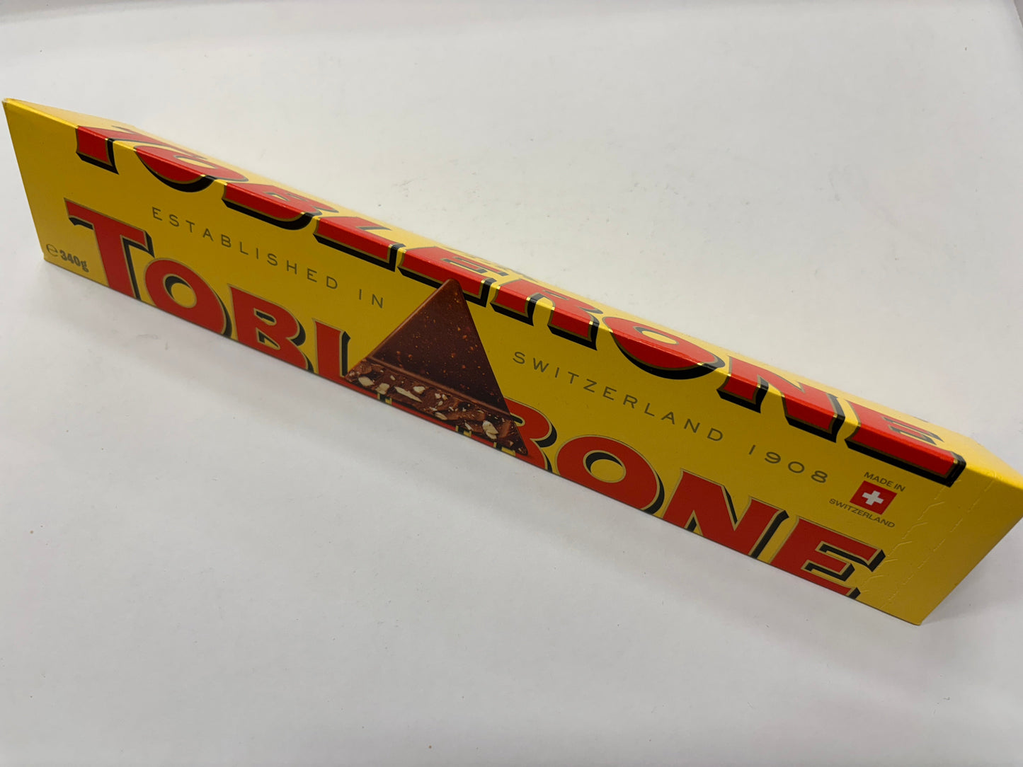 Select Sweets Milk Chocolate Toblerone Bar in Iconic Yellow Packaging with Chocolate Triangles