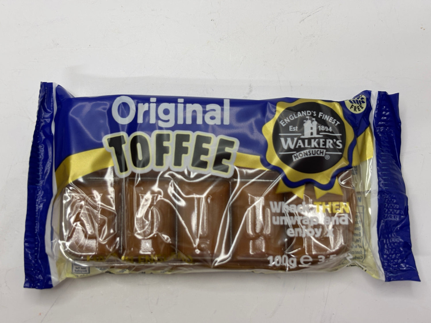 Walkers original toffee slab in blue and gold packaging with visible chocolate-covered toffee pieces
