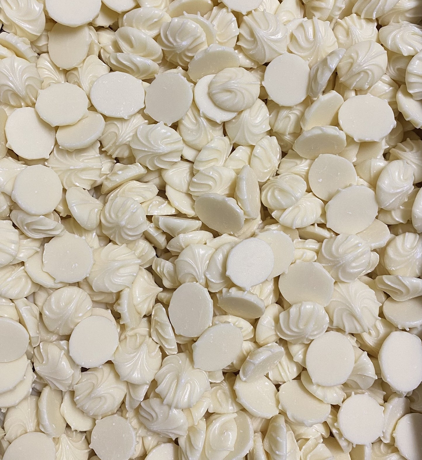Close-up of white chocolate whirls with smooth and swirled shapes from SelectSweets